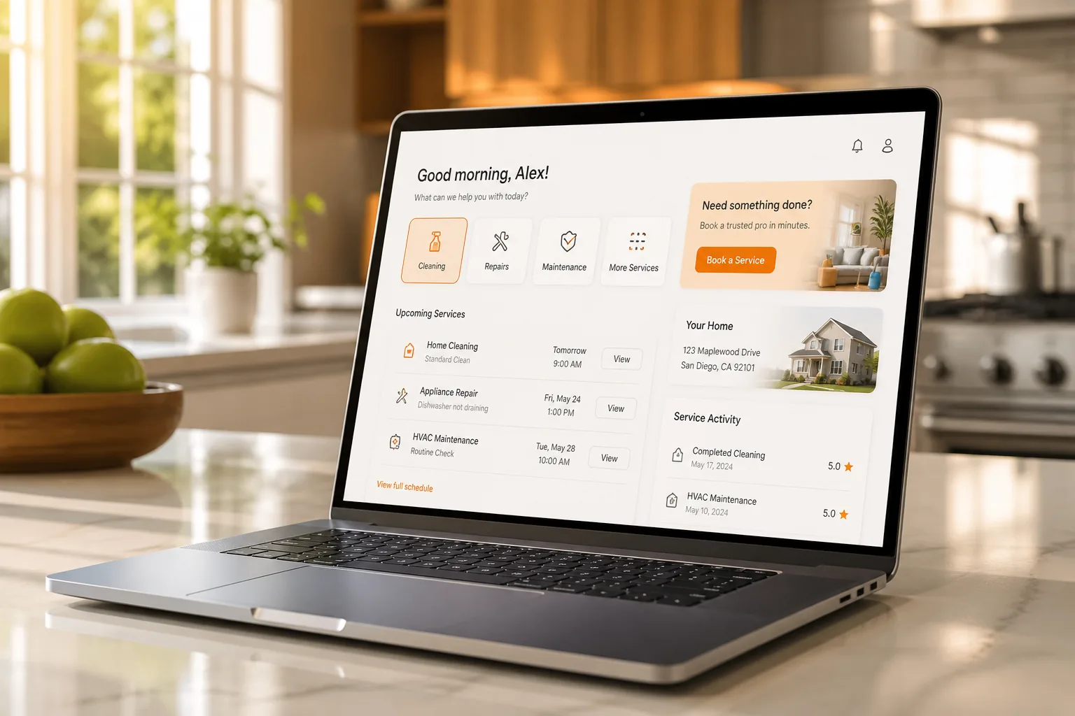Laptop showing a home service platform dashboard with bookings, technician tracking, and business analytics